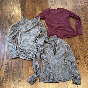 Three long sleeve athletic jogging tops